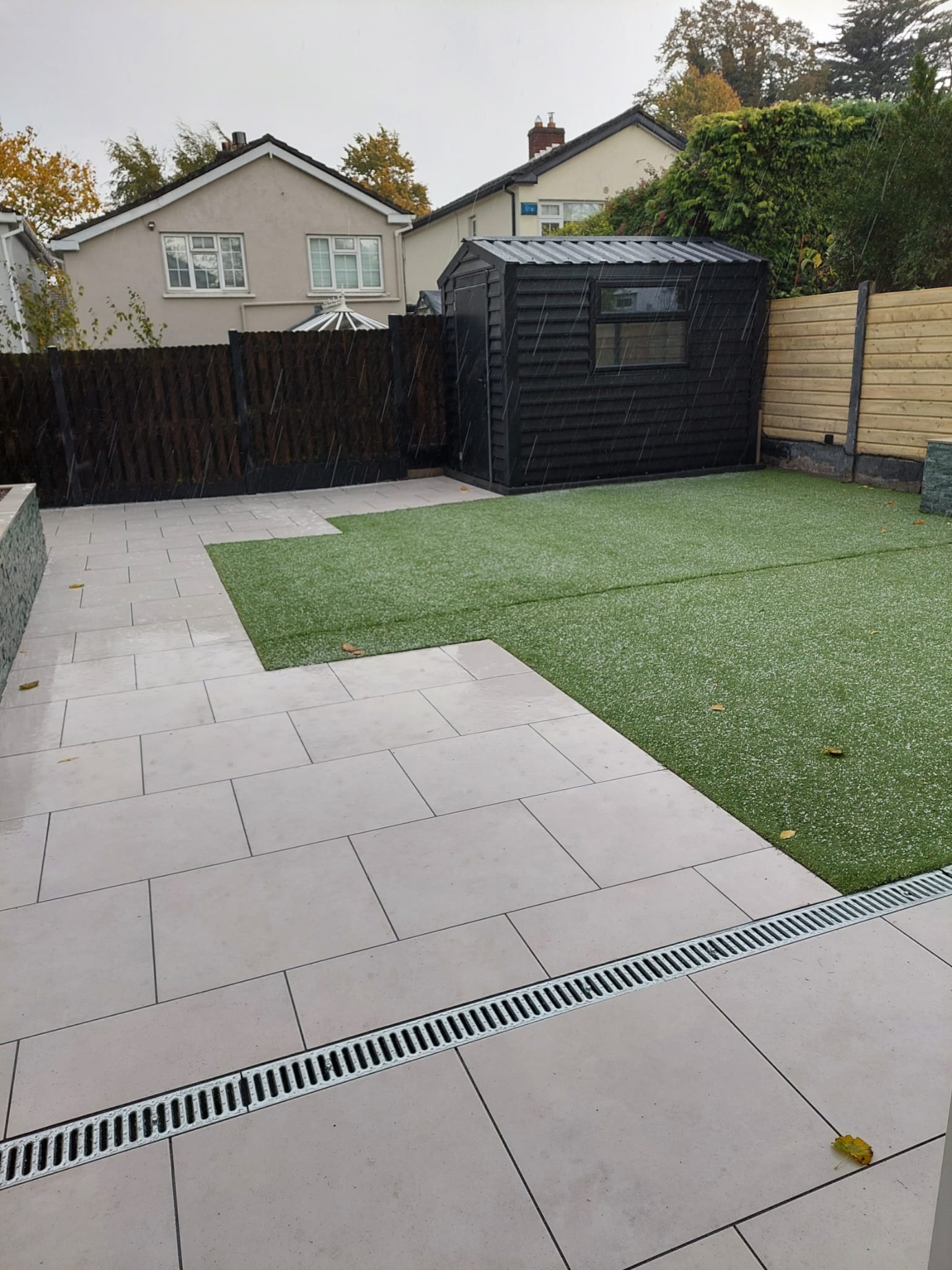 Paving stones and artificial grass laid in a garden