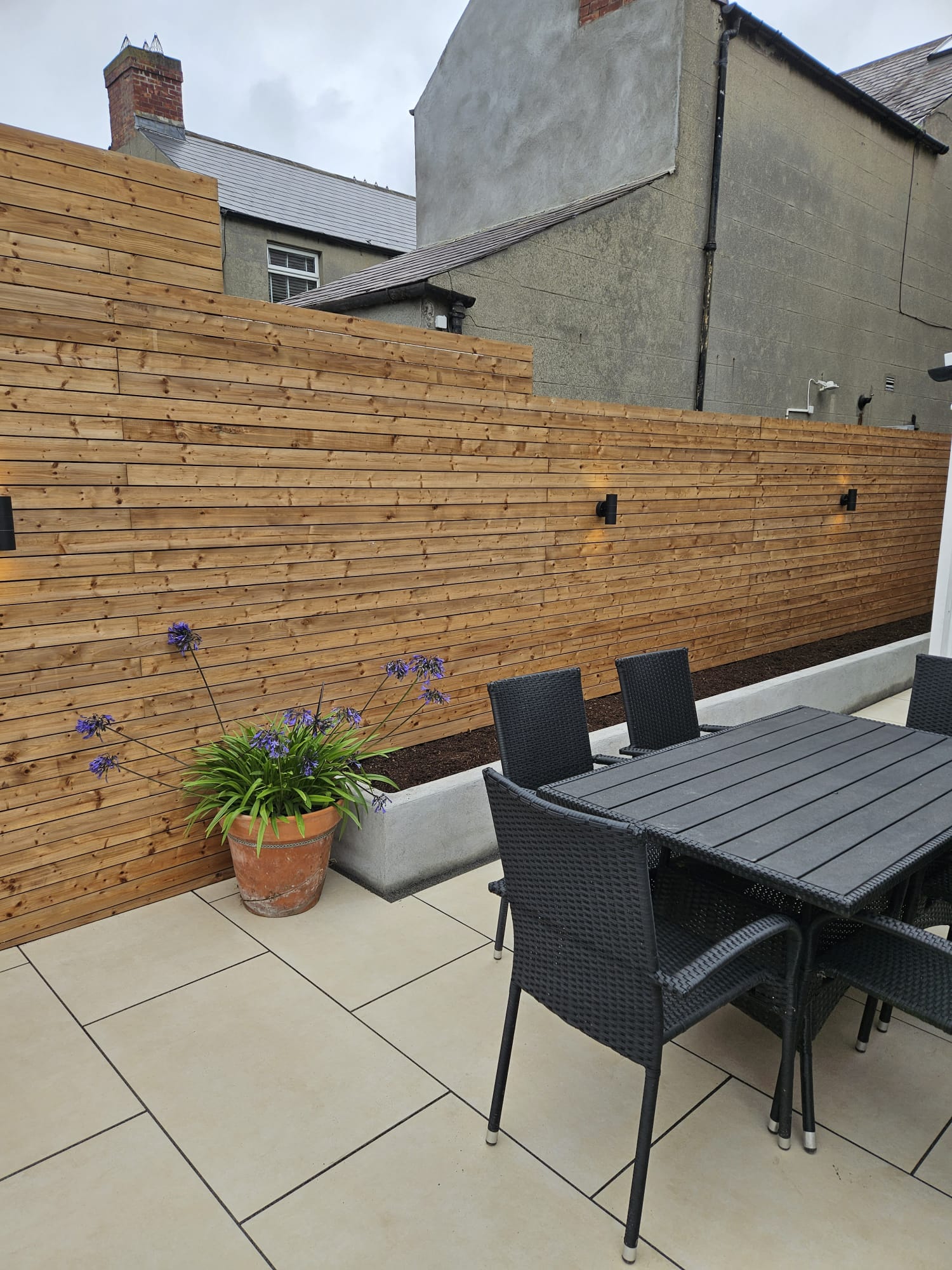 horizontal fence and custom flower bed