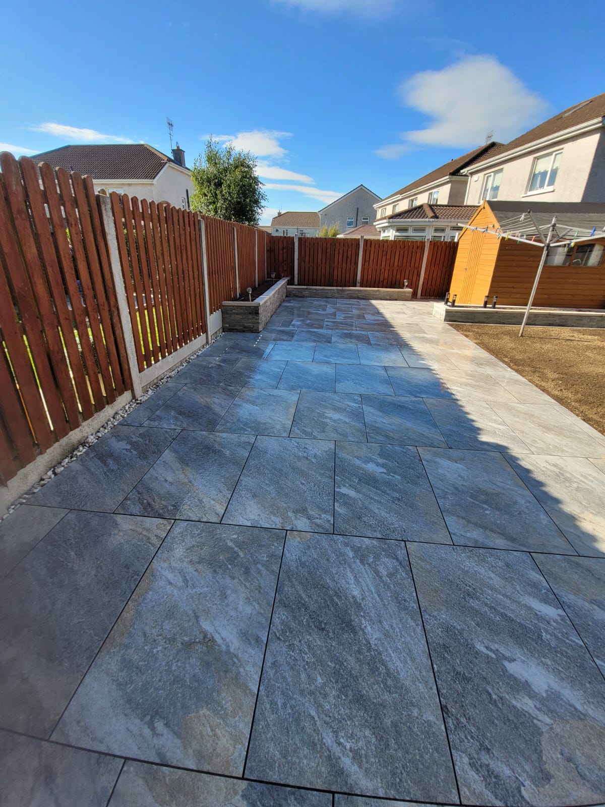 Paved enclosed back garden