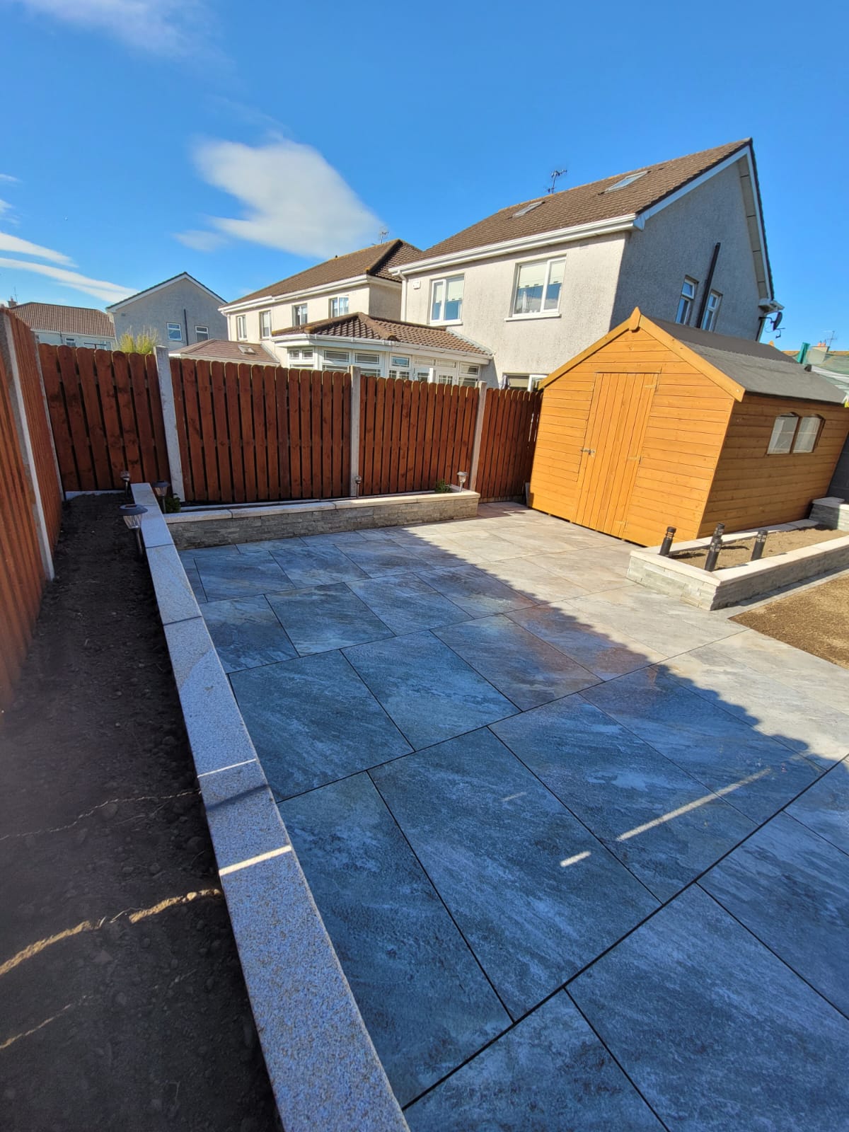 enclosed garden with paved patio