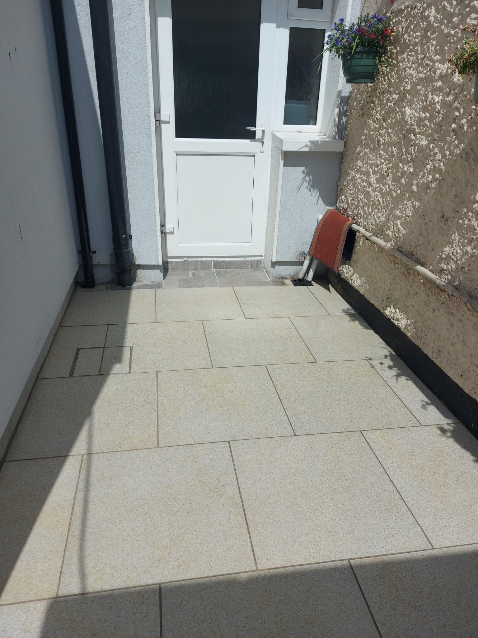 Paving stones leading to the door of a house