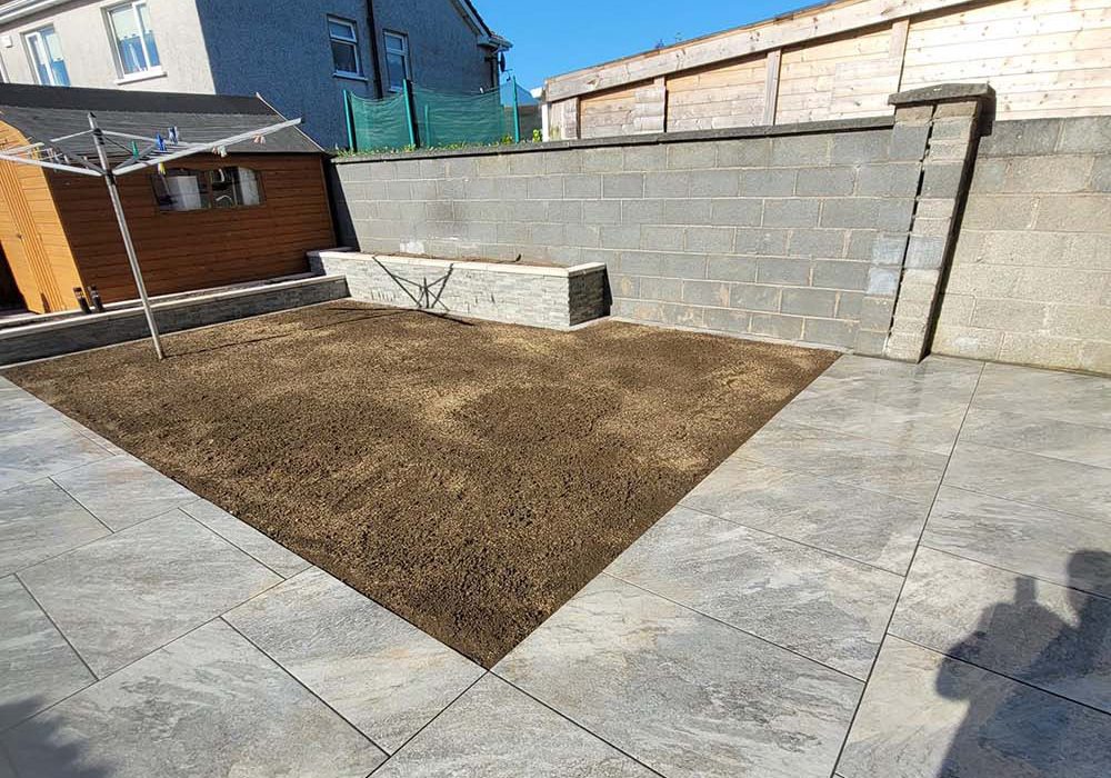 Paved garden with disturbed soil